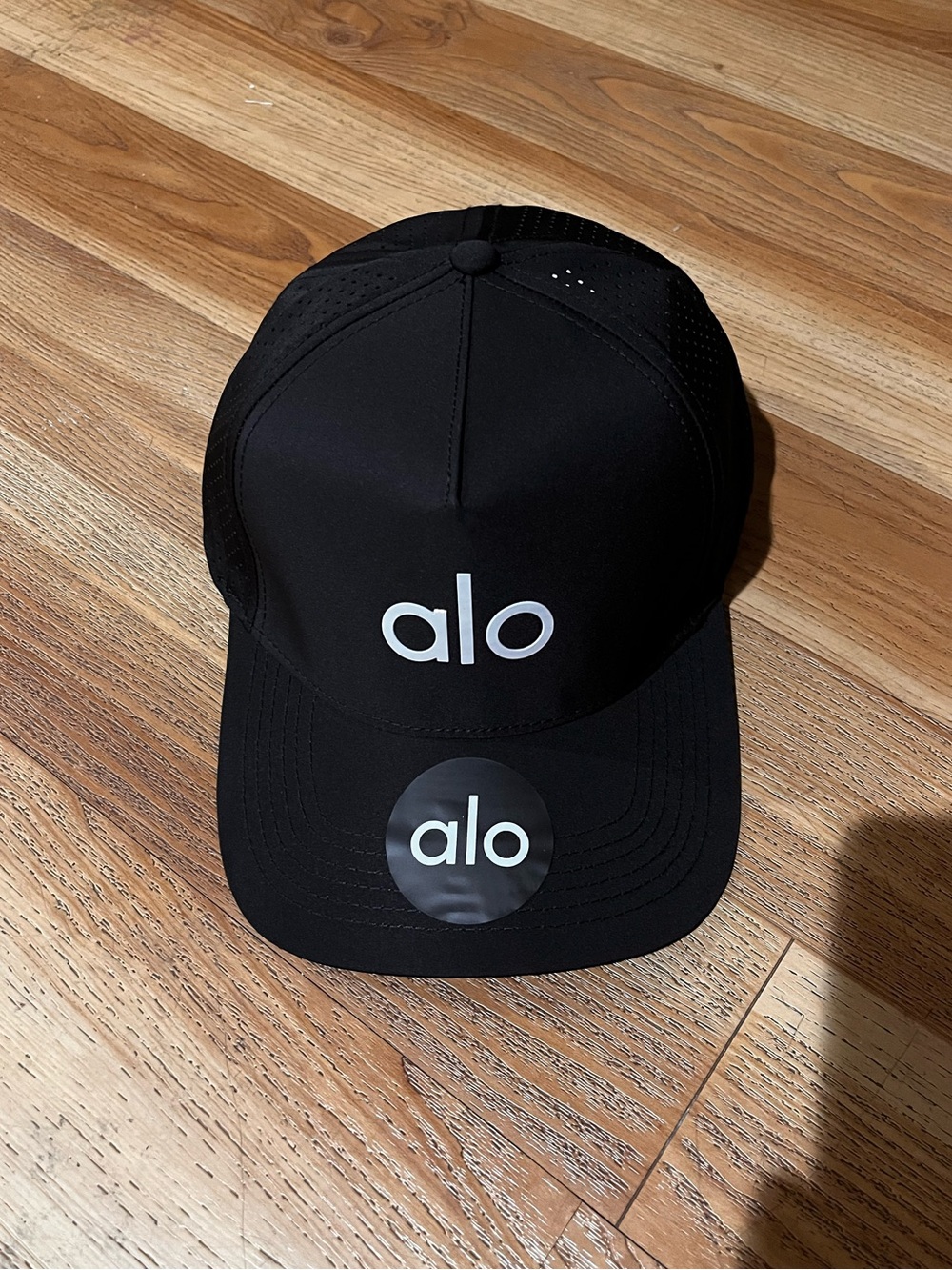 ALO Yoga Black Performance Trucker Hat with White Logo